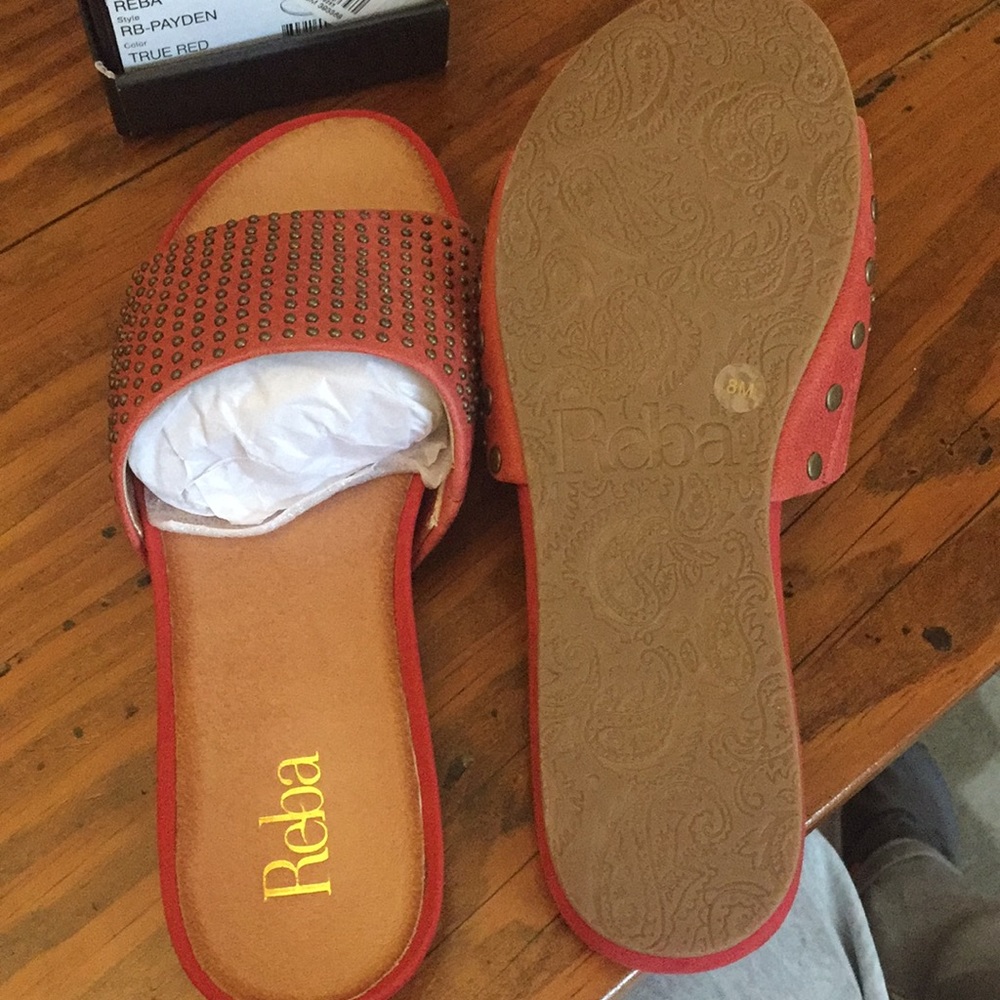 Faded red leather slide sandals